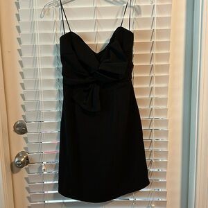 LITTLE BLACK STRAPLESS DRESS MEDIUM BY LUSH. BLACK BOW ON FRONT. ZIP BACK